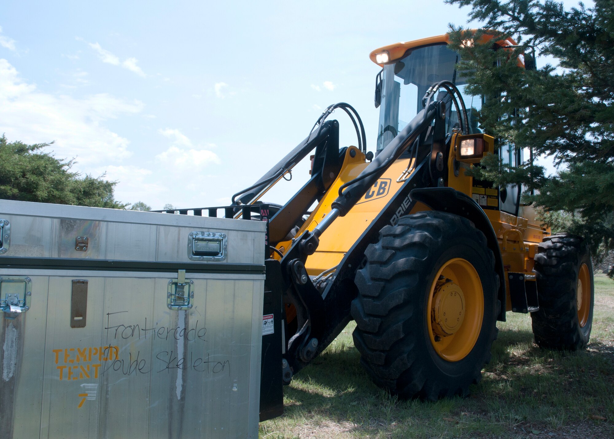 Tech. Sgt. Michael Klemm, 90th Civil Engineers Squadron, operates a forklift July 14, 2014, in preparation for Fort D.A. Russell Days. 90th CES set up six tents in support of Fort D.A. Russell Days. (U.S. Air Force photo by Airman Malcolm Mayfield) 