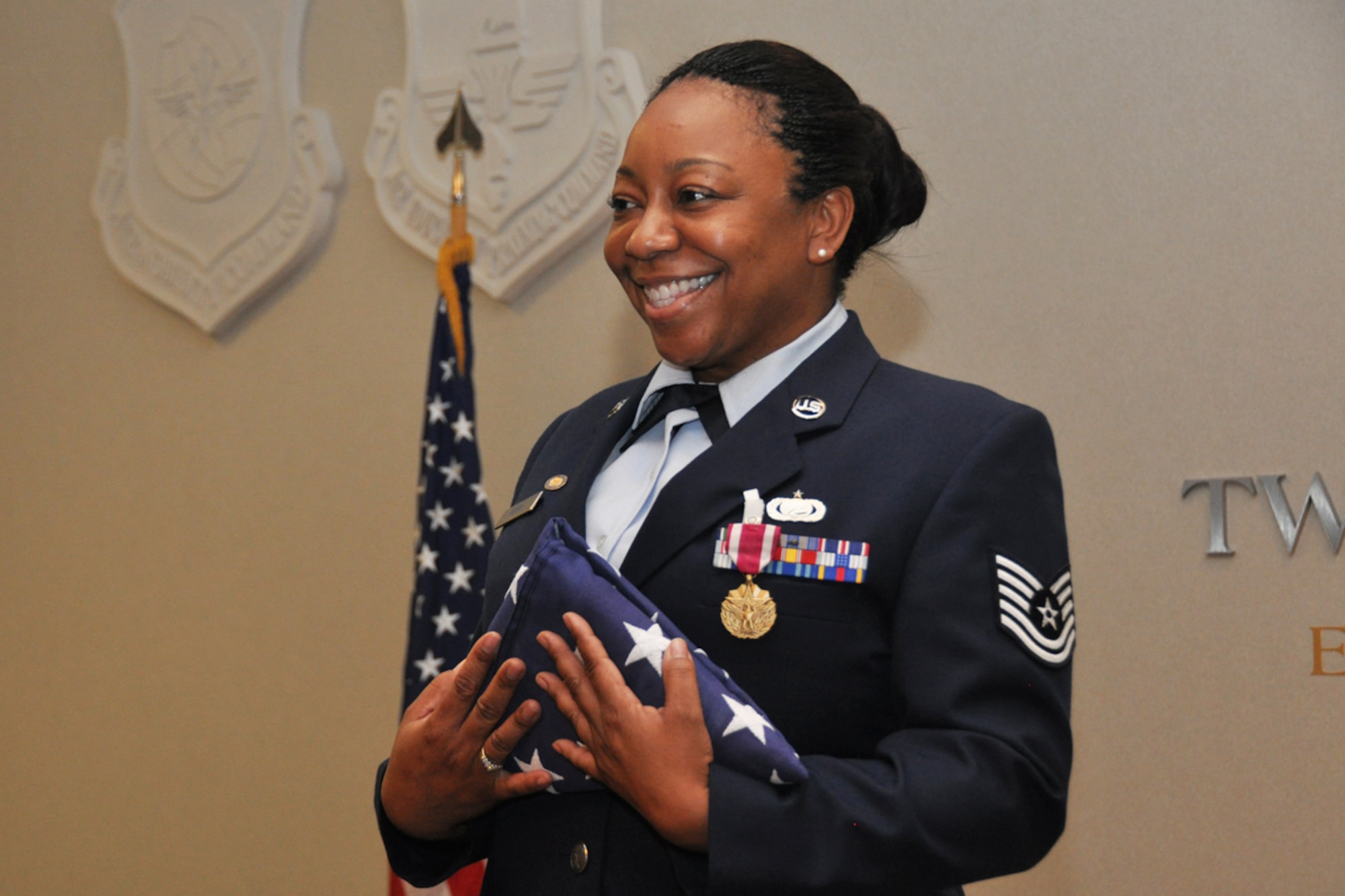 Tech. Sgt. Marla Camille Rubin of the 94th Communications Squadron is honored for 20 years of military service during her retirement ceremony June 24, 2014. (U.S. Air Force photo/Staff Sgt. Karla Lehman)