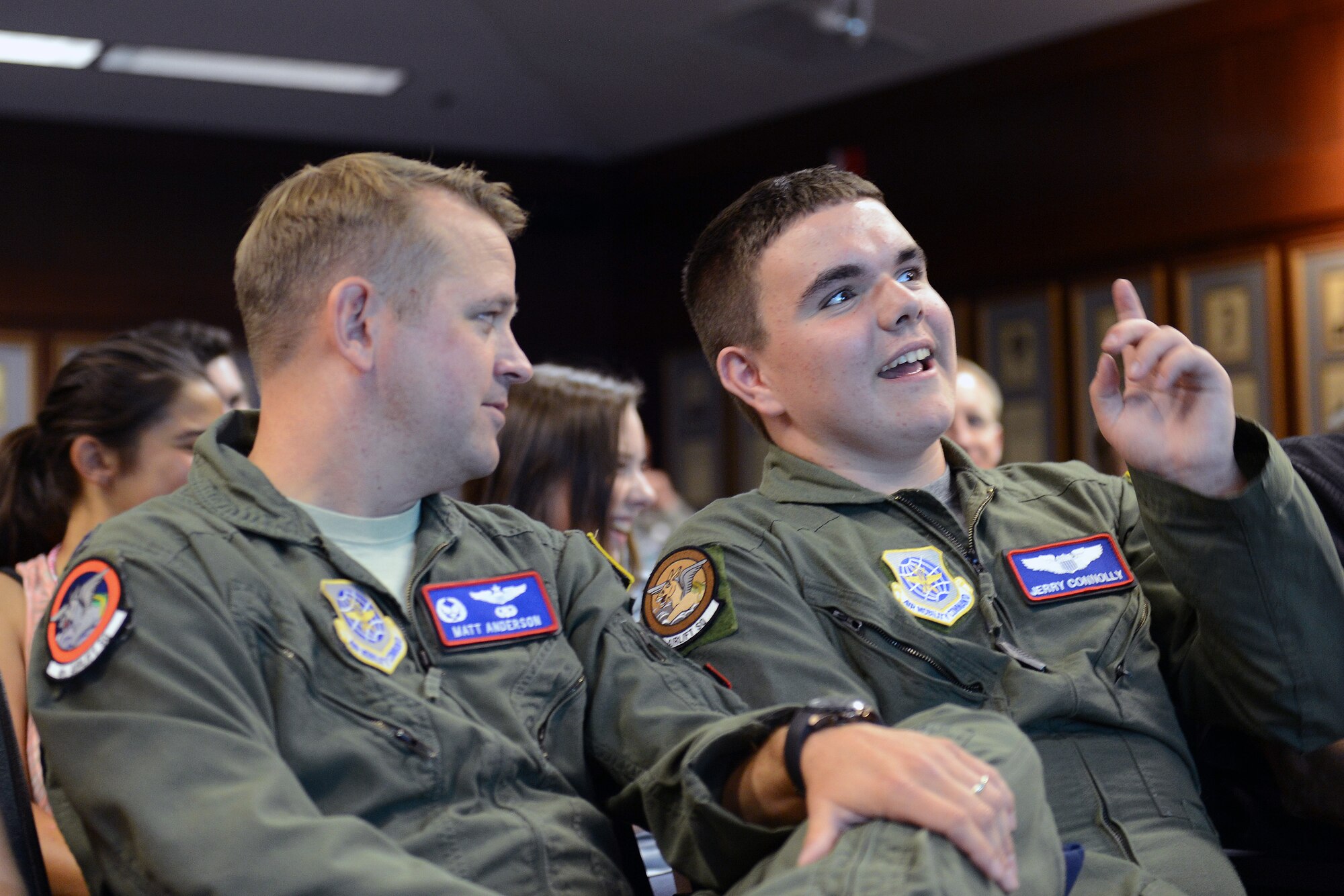 Jerry Connolly (right), pilot for a day, inquires with Lt. Col. Matt Anderson, 4th Airlift Squadron commander, about a secret squirrel mission during a pre-mission briefing July 14, 2014, at Joint Base Lewis-McChord, Wash. Connolly was given an in-depth briefing on his special mission before going to the C-17 Globemaster III simulator. (U.S. Air Force photo/Airman 1st Class Jacob Jimenez)