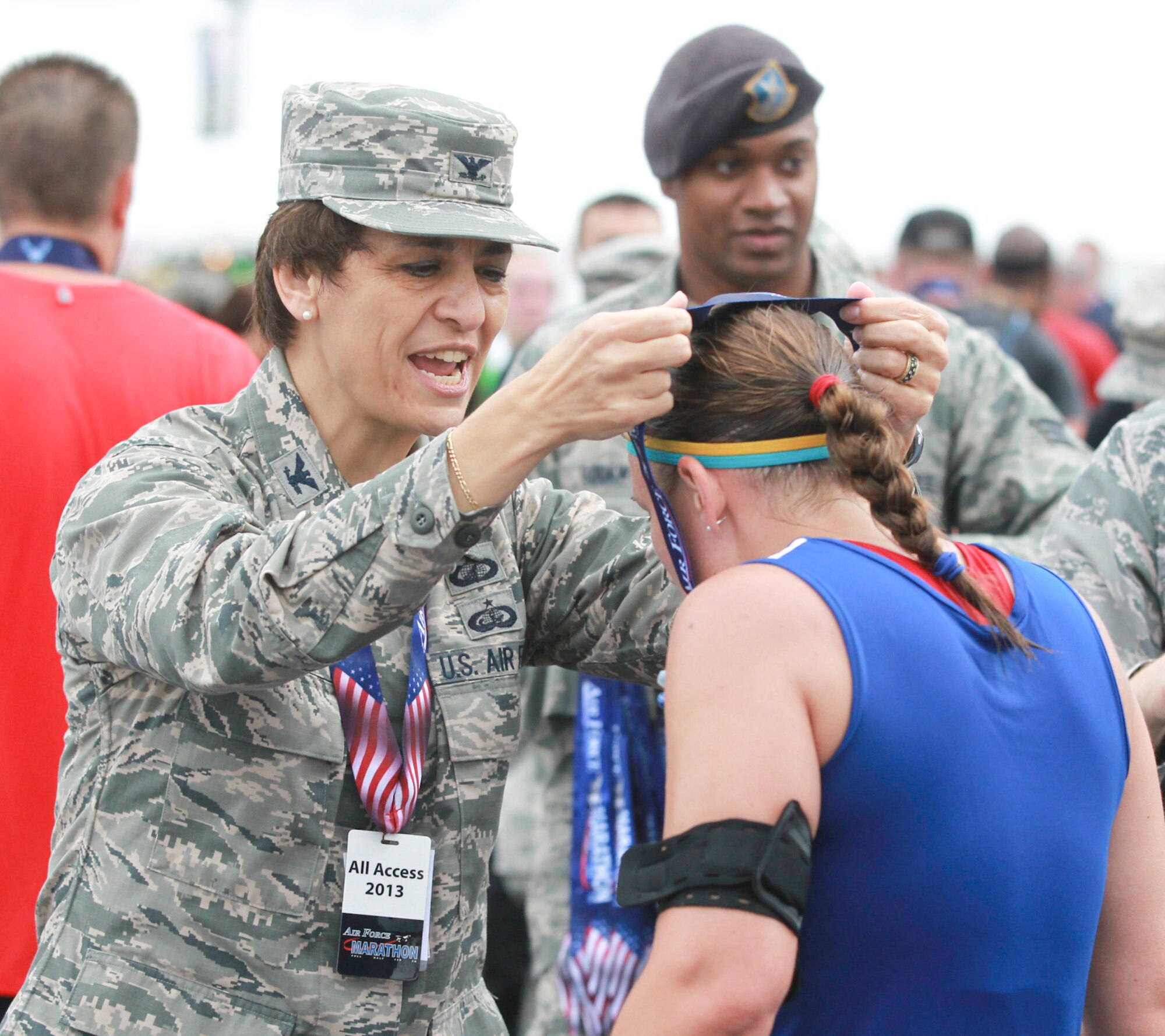 Among the highlights during Col. Cassie Barlow’s tour at Wright-Patterson Air Force Base was the opportunity to present medals to Air Force Marathon participants as they crossed the finish line. Wright-Patterson AFB hosts the marathon each year in mid-September. (Photo courtesy of Chris Stewart/ CMGO) 
