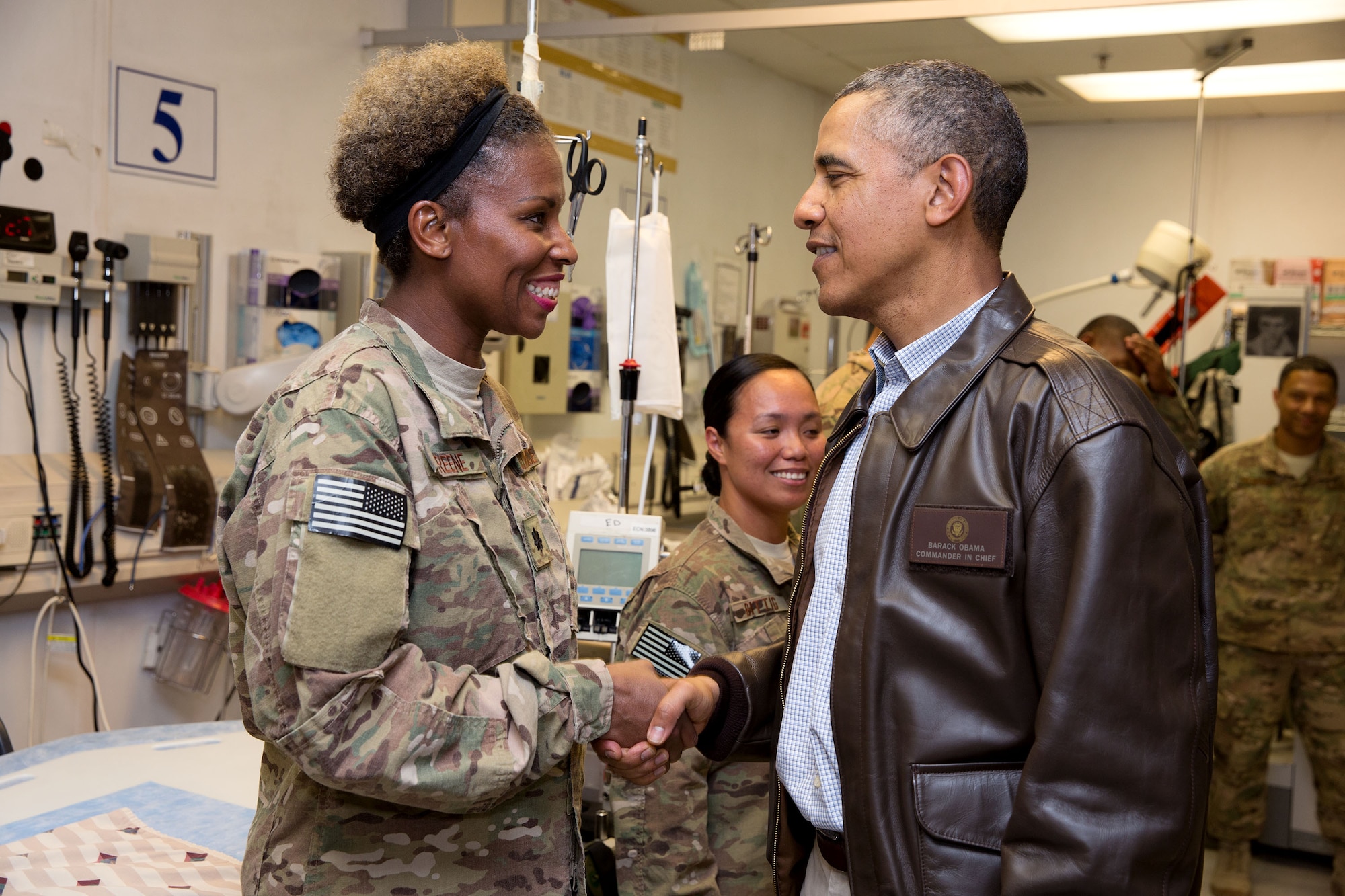 Lt. Col. Stacy Greene, 455th Contingency Aerospace Staging Facility
commander, greets President Barack Obama during his tour of the Craig Joint
Theatre Hospital, Bagram Airfield, Afghanistan. During his visit, Obama
thanked Airmen for providing exceptional health care to deployed service
members. Greene and several other members of the 455th CASF are based out
of the 59th Medical Wing at Joint Base San Antonio-Lackland, Texas.
(Courtesy photo)