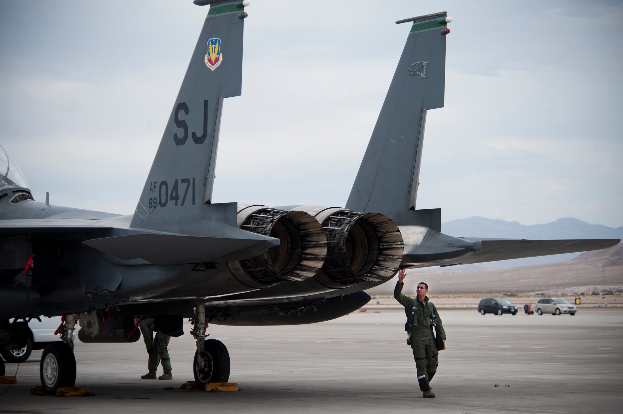 Capt. Bobby Malesra, 335th Fighter Squadron F-15E Strike Eagle pilot, Seymour Johnson Air Force Base, N.C. performs preflight checks at the start of Red Flag 14-3 July 14, 2014, Nellis AFB, Nev.   Red Flag is a realistic combat training exercise aimed to provide real world scenarios within a controlled environment. (U.S. Air Force photo by Lawrence Crespo) 