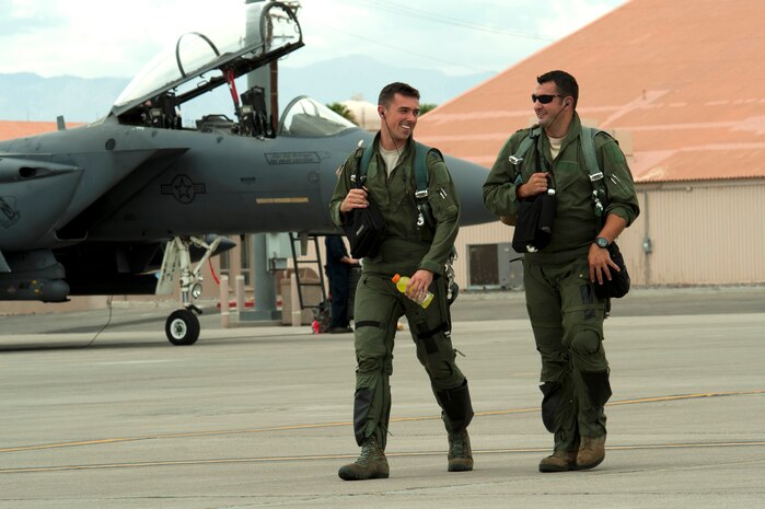 Capt. Eric Joachim (left) and Capt Dale Gogan, both 335th Fighter Squadron F-15E Strike Eagle pilots, walk to their aircraft to participate in a Red Flag 14-3 sortie July 14, 2014, at Nellis Air Force Base, Nev. July 14 was the first day of Red Flag 14-3 and the exercise is scheduled to last until July 25. (U.S. Air Force photo by Senior Airman Timothy Young)