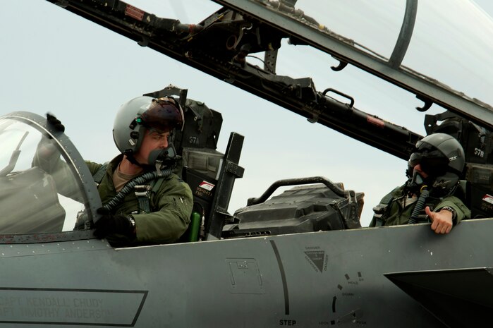 Capt. Matthew Olde, 335th Fighter Squadron F-15E Strike Eagle pilot (left), receives a thumbs up from Capt. Bobby Malesra, 335th FS F-15E pilot, while prepping for takeoff during Red Flag 14-3 July 14, 2014, at Nellis Air Force Base, Nev. Before takeoff, both maintainers and pilots test all the aircraft’s systems to ensure a safe flight. (U.S. Air Force photo by Senior Airman Timothy Young)