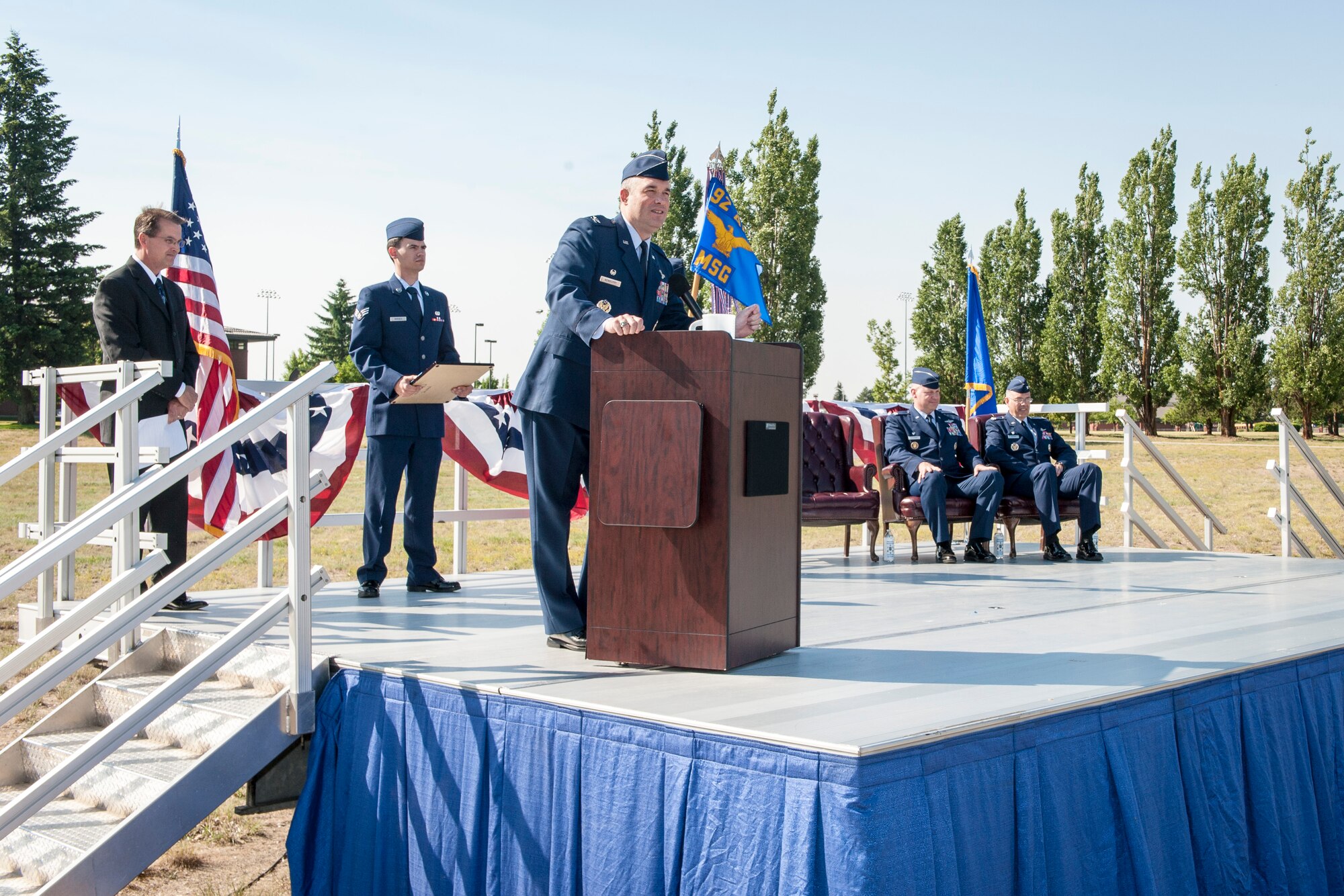 Col. Brian Newberry addresses Fairchild Airmen and community members during the 92nd Mission Support Group change of command ceremony at Fairchild Air Force Base, Washington, July 11, 2014. The change of command ceremony is a tradition that represents a formal transfer of authority and responsibility. Newberry is the 92nd Air Refueling Wing commander. (U.S. Air Force photo by Staff Sgt. Benjamin W. Stratton/Released)