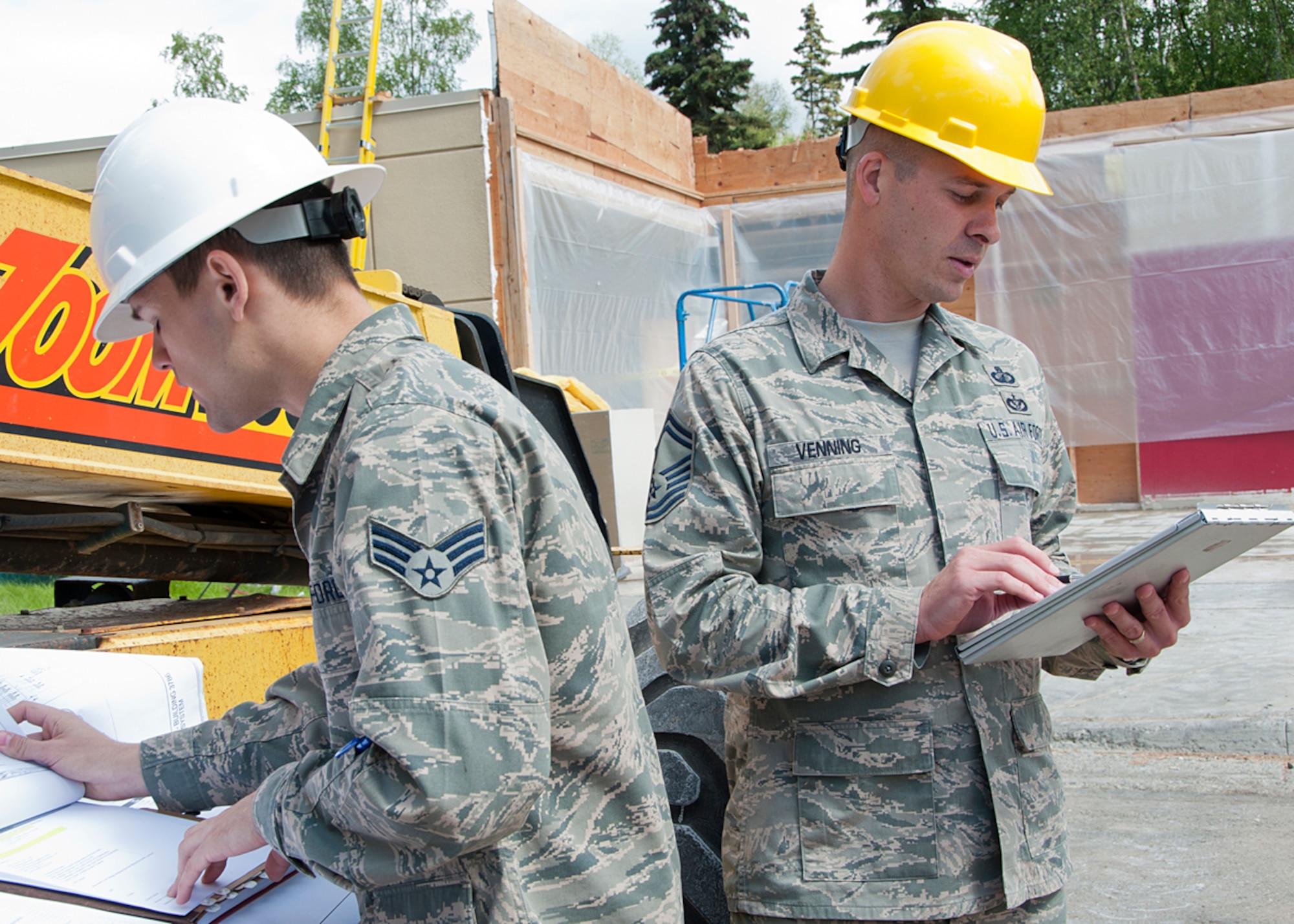 Senior Master Sgt. Michael Venning, 673d Contracting Squadron superintendent, performs a site-visit and inspection on a recent construction project awarded at Joint Base Elmendorf-Richardson, Alaska, July 12, 2014. Venning is one of the Air Force's 12 Outstanding Airmen of the Year. The award recognizes 12 outstanding enlisted service members for superior leadership, job performance, community involvement and personal achievements. (U.S. Air Force photo/Airman 1st Class Ty-Rico Lea)