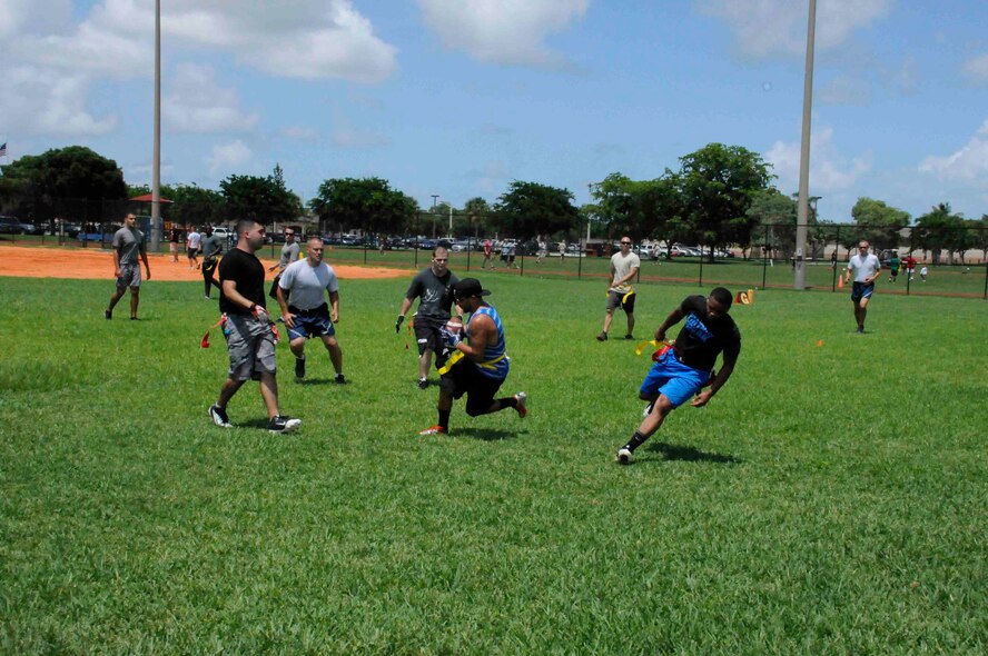 Members of the 482nd Fighter Wing play flag football at Homestead Air Reserve Base, Florida, as part of Wingman Day on July 12. (U.S. Air Force photo by/Senior Airman Aja Heiden)