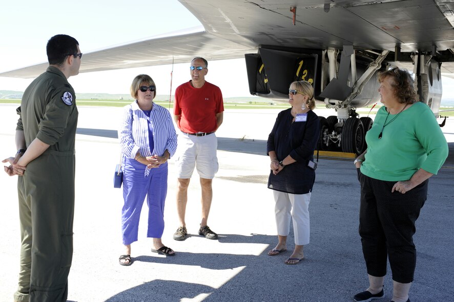 Members of the Military Impacted School Association listen as Capt. Austin Fouts, 23rd Bomb Squadron B-52 pilot from Minot Air Force Base, N.D., on temporary duty at Ellsworth Air Force Base, S.D., answers questions about being a B-52 aviator during a tour of Ellsworth June 24, 2014. Administrators and faculty from across the nation had the opportunity to see and learn about the B-1 bomber and B-52 during a base tour. (U.S. Air Force photo by 2nd Lt. Rachel Allison/Released)