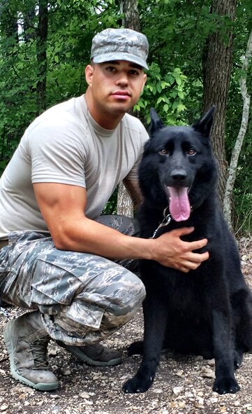 Staff Sgt. Paul Olmos III, 91st Missile Security Forces Group tactical response force team leader, and his Military Working Dog Dion, pose for a photograph during the K-9 Handlers Course at Lackland Air Force Base San Antonio, Texas. Olmos received the Top Dog Award during the course and also graduated top of the class. Dion is a four-year-old, German Sheppard and was born in March. (courtesy photo) 