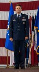 Col. Jason Armagost, 5th Bomb Wing commander, takes control of the flight after a Change of Command ceremony on Minot Air Force Base, N.D., July 14, 2014. Armagost took command of the 5th BW from Col. Alex Mezynski, who will be leaving for Al Udeid Air Base, Qatar. (U.S. Air Force photo/Senior Airman Stephanie Morris)