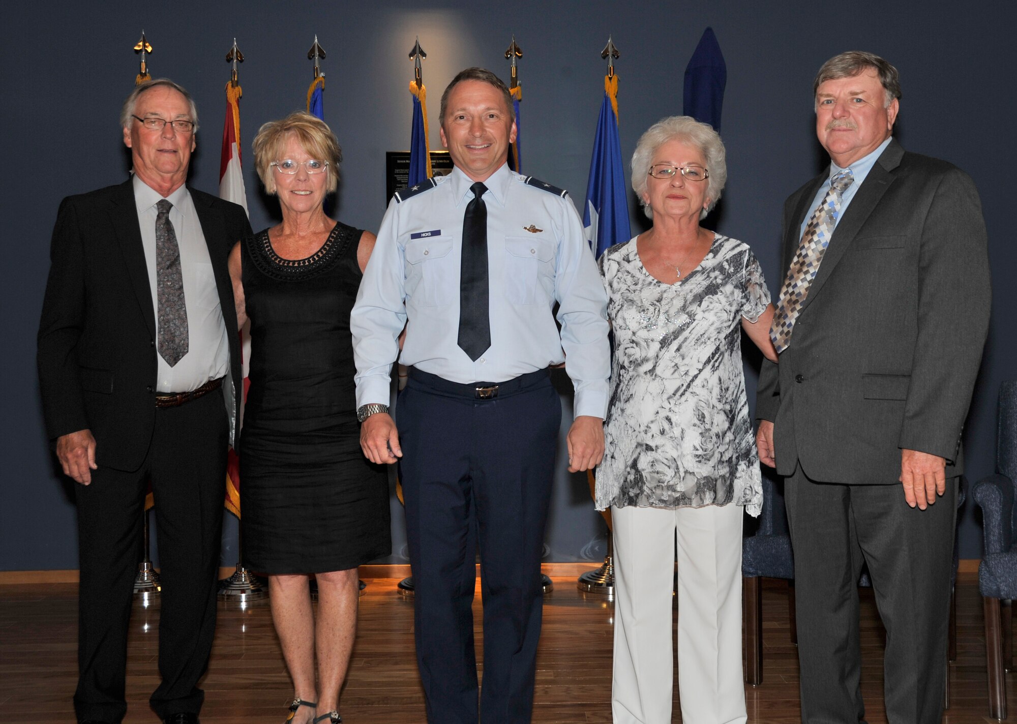 Recent brigadier general promotee David Hicks, Air Forces Northern Vice Commander, stands with his family and family friend following his promotion ceremony July 3 at Horizons. 