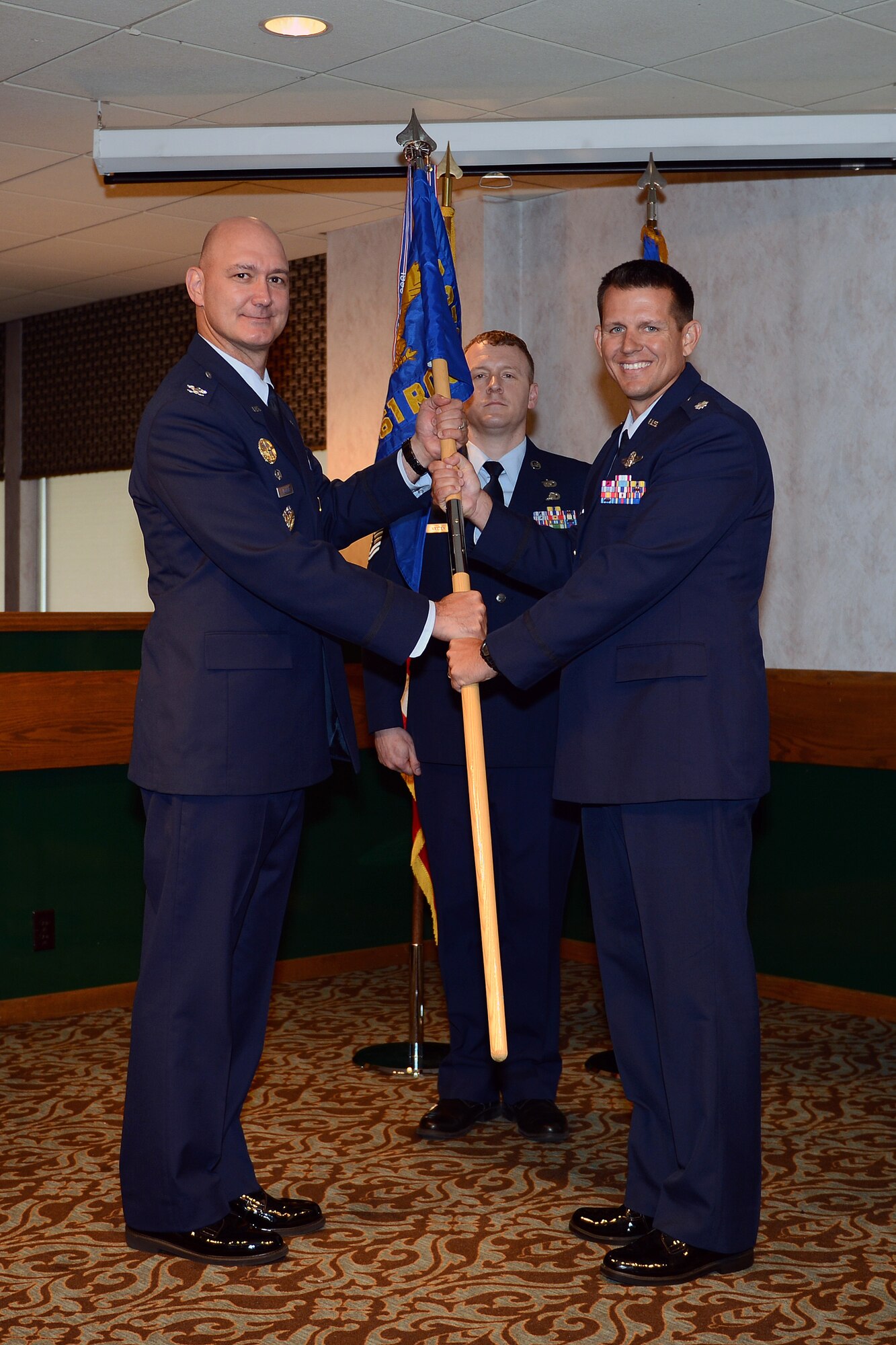 Col. Frederick Williams (left), 372nd Recruiting Group commander, gives command of the 361st Recruiting Squadron to Lt. Col. Jason Scott during a change of command ceremony at Joint Base Lewis-McChord, Wash., June 26. (U.S. Air Force photo/Airman 1st Class Jacob Jimenez)