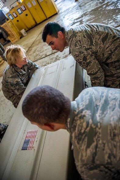 Airmen from the 387th Expeditionary Support Squadron practice for dignified transfers July 12, 2014 at an undisclosed location in Southwest Asia. These airmen train to handle those who have fallen in the line of duty with dignity and respect as they make their journey home to their families. These Airmen are available 24 hours, seven days a week for any dignified transfer. (U.S. Air Force photo by Staff Sgt. Jeremy Bowcock)