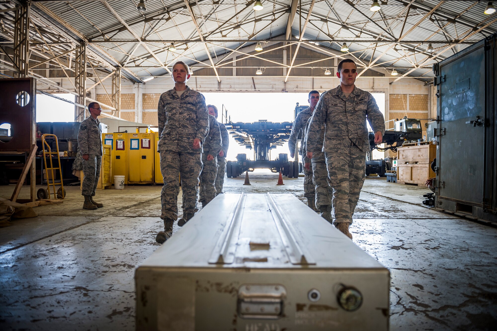 Airmen from the 387th Expeditionary Support Squadron practice for dignified transfers July 12, 2014 at an undisclosed location in Southwest Asia. These airmen train to handle those who have fallen in the line of duty with dignity and respect as they make their journey home to their families. These Airmen are available 24 hours, seven days a week for any dignified transfer. (U.S. Air Force photo by Staff Sgt. Jeremy Bowcock)