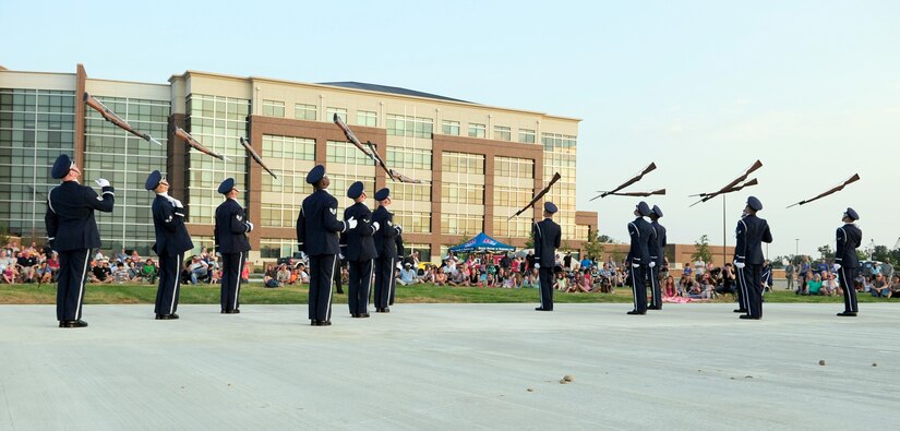 Members of the U.S. Air Force Honor Guard Drill Team perform during the Joint Base Andrews Heritage Park Concert, July 12, 2014. The concert series was designed to show appreciation to the local community for their support and showcase JBA's dedicated Airmen. This was the second of three concerts scheduled for this summer. (U.S. Air Force photo/Staff Sgt. Torey Griffith)