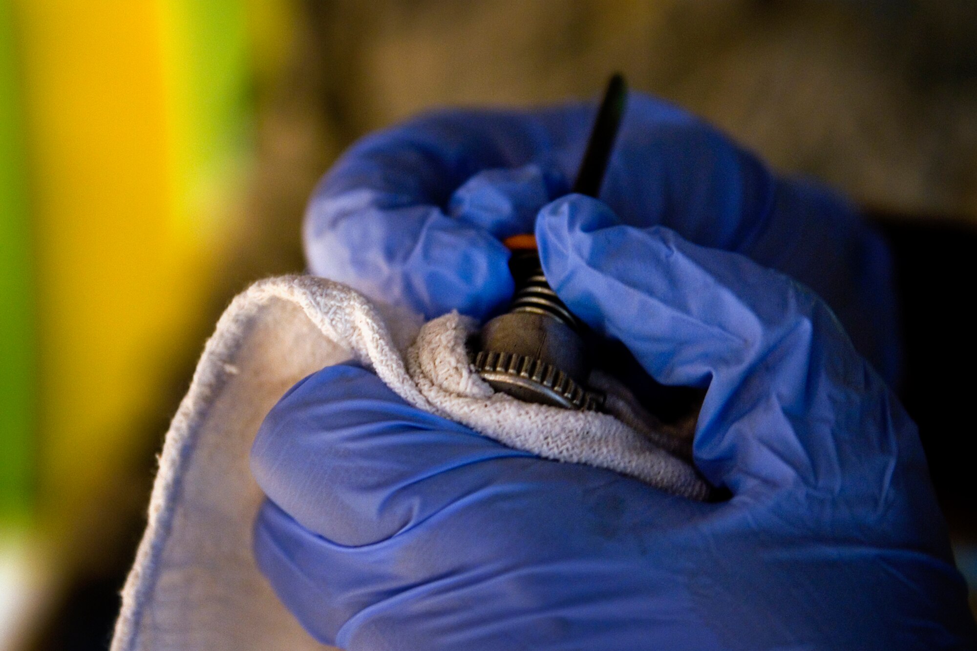 Airman 1st Class Atkinson Giavante , 434th Aircraft Maintenance Squadron crew chief, changes an oil drain plug o-ring from a KC-135R air cycle machine during a recent home station check at Grissom Air Reserve Base, Ind., July 12, 2014. Prior to conducting the maintenance Giavante reviewed the technical order to ensure all the maintenance was done according the manufacture?s specifications. (U.S. Air Force photo/Staff Sgt. Ben Mota)
