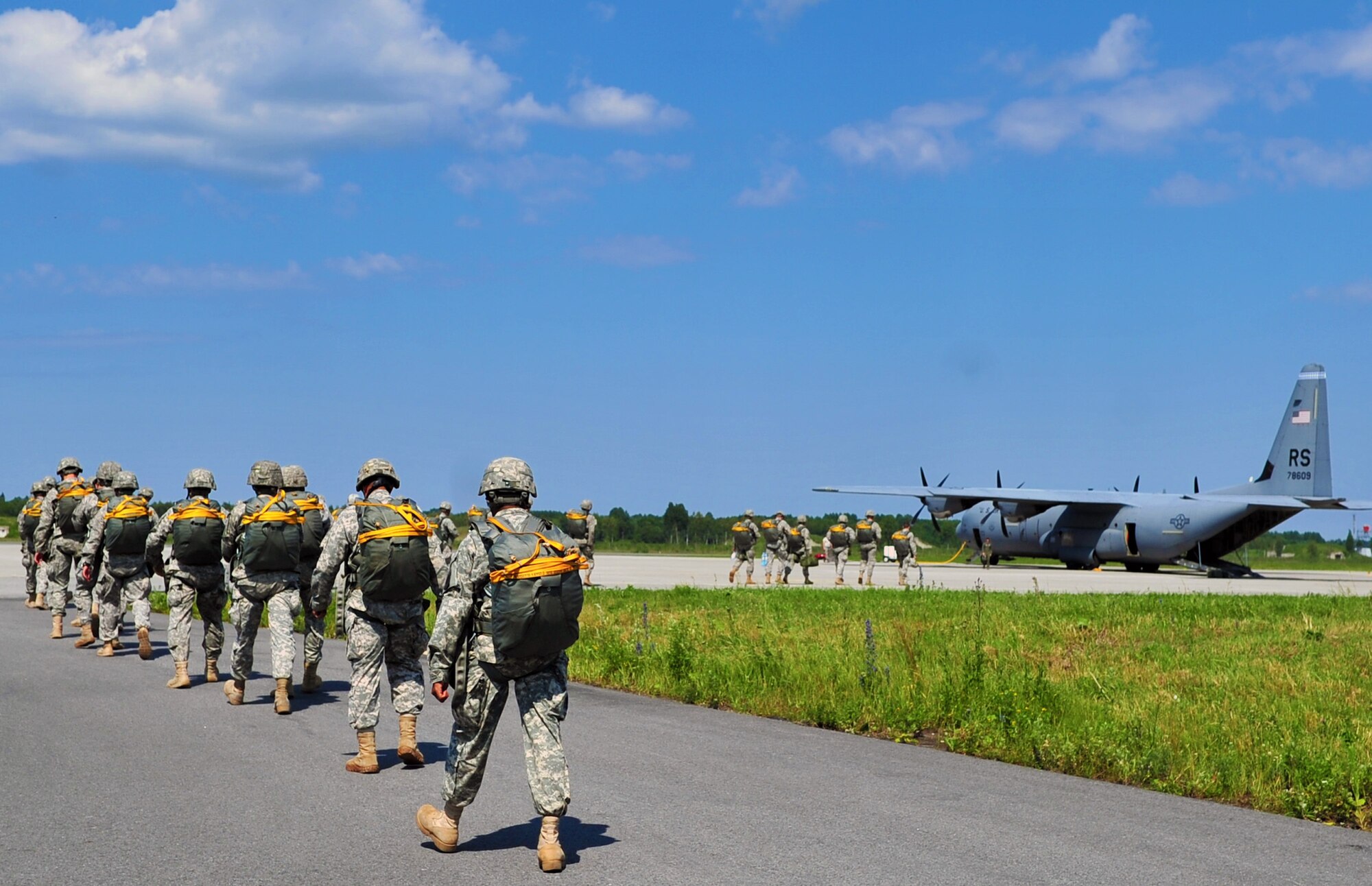 U.S. Army soldiers from 1-91 Cavalry Regiment, 173rd Infantry Brigade Combat Team (Airborne), Grafenwoehr, Germany, prepare to board a C-130J Super Hercules from the 37th Airlift Squadron based out of Ramstein Air Base, Germany, for a personnel drop mission in Estonia July 8, 2014. (U.S. Air Force photo by Senior Airman Christine Griffiths/Released)