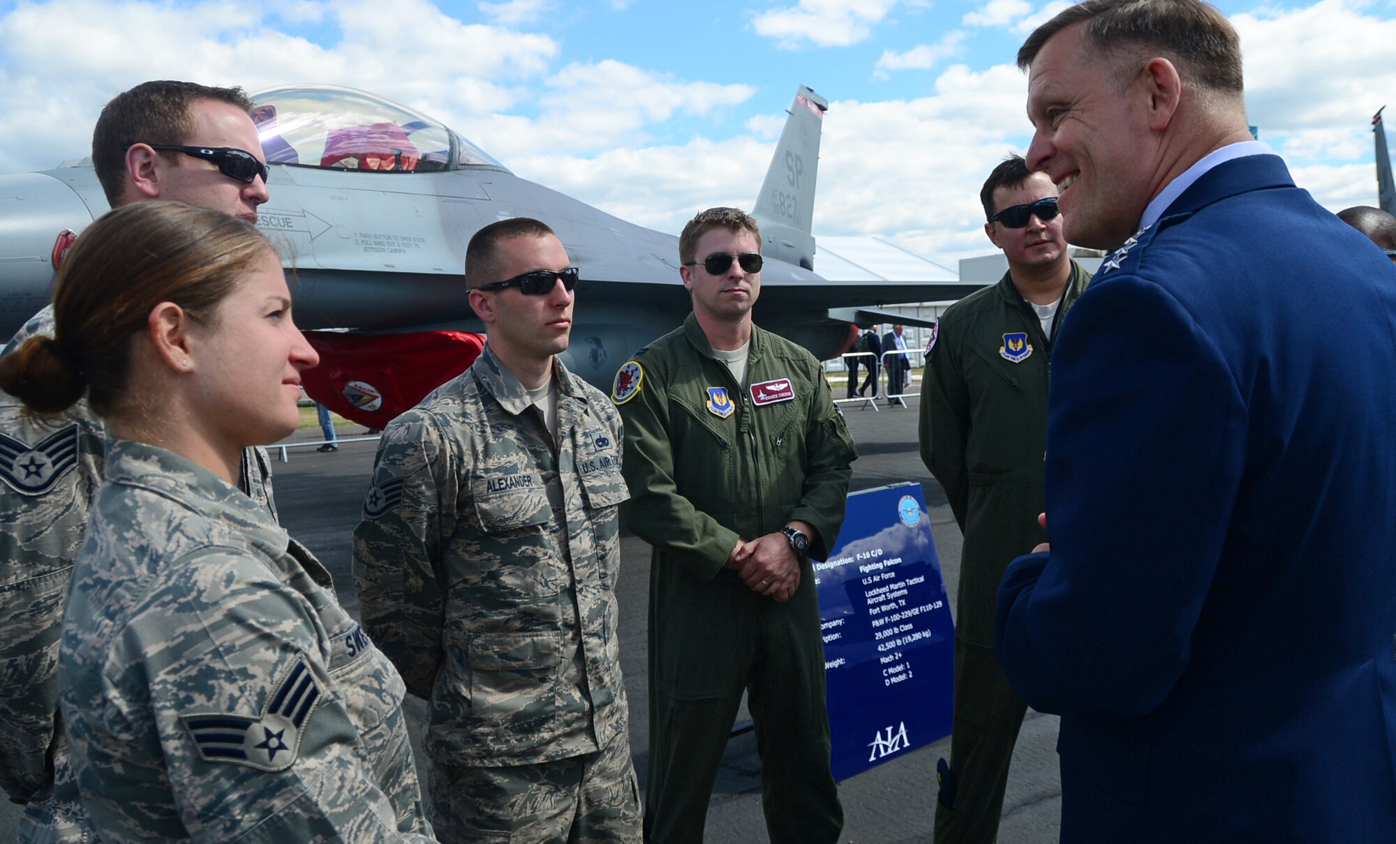 General Frank Gorenc, U.S. Air Forces in Europe-Air Forces Africa and Allied Air Command commander, speaks with Airmen during a static display tour at Farnborough International Airshow, England, July 14, 2014. Participation in FIA highlights the strength of the U.S. commitment to the security of NATO, the strong alliance with the U.K., and demonstrates interoperability with allies and the defense industry state-of-the-art capabilities.(U.S. Air Force photo by Airman 1st Class Erin O'Shea)