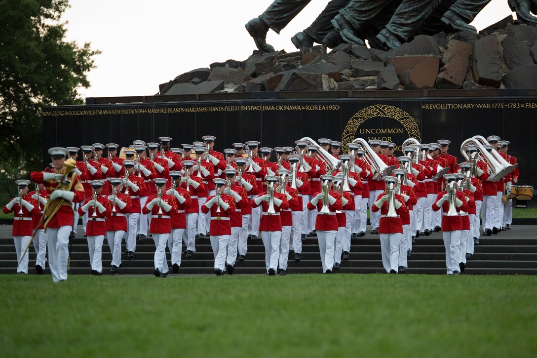 The United States Marine Drum & Bugle Corps perform during a Tuesday Sunset Parade at the Marine Corps War Memorial in Arlington, Va., July 16. (Official Marine Corps photo by Cpl. Larry Babilya/Released)