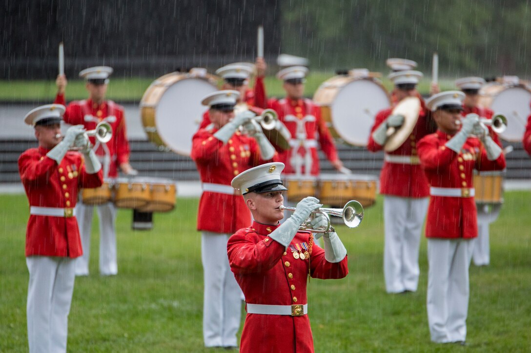 The United States Marine Drum & Bugle Corps perform during a Tuesday Sunset Parade at the Marine Corps War Memorial in Arlington, Va., July 16. (Official Marine Corps photo by Cpl. Larry Babilya/Released)
