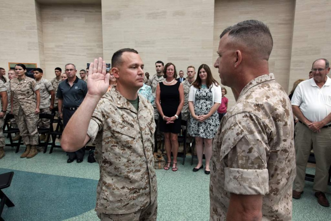 U.S. Marine Maj. James R. McGrath, Commanding Officer of Military Information Operations Company, Marine Corps Information Operations Center, is promoted to Lieutenant Colonel at the Marine Corps Museum, Triangle, Virginia, July 3, 2014. (U.S. Marine Corps photo by Sgt. Kristofer Atkinson/Released)