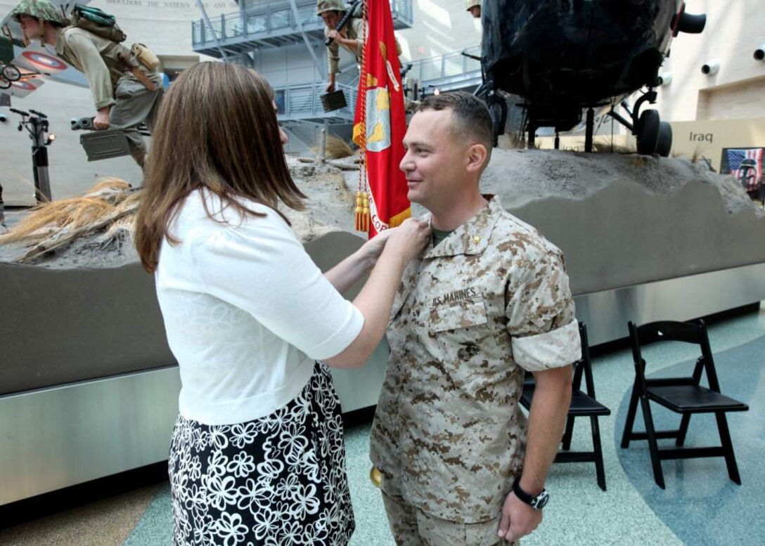 U.S. Marine Maj. James R. McGrath, Commanding Officer of Military Information Operations Company, Marine Corps Information Operations Center, is promoted to Lieutenant Colonel at the Marine Corps Museum, Triangle, Virginia, July 3, 2014. (U.S. Marine Corps photo by Sgt. Kristofer Atkinson/Released)