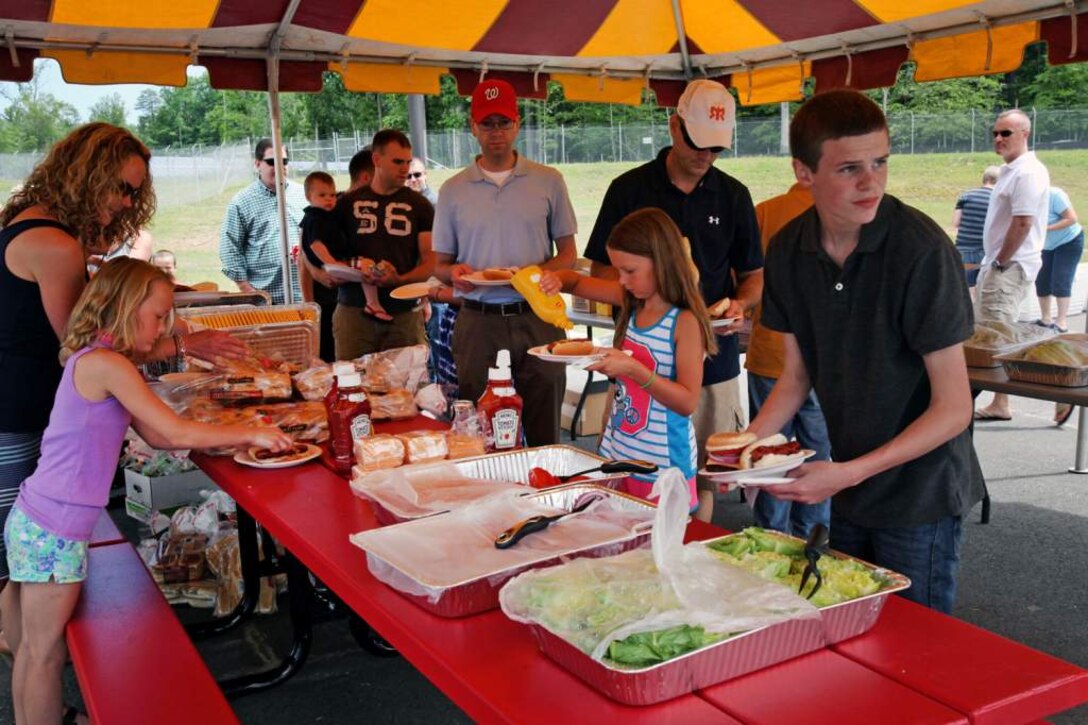 U.S. Marines and civilians of the Marine Corps Information Operations Center gather together for family day at Walt Hall, Quantico, Virginia, June 20, 2014. (U.S. Marine Corps photo by Sgt. Kristofer Atkinson/Released)