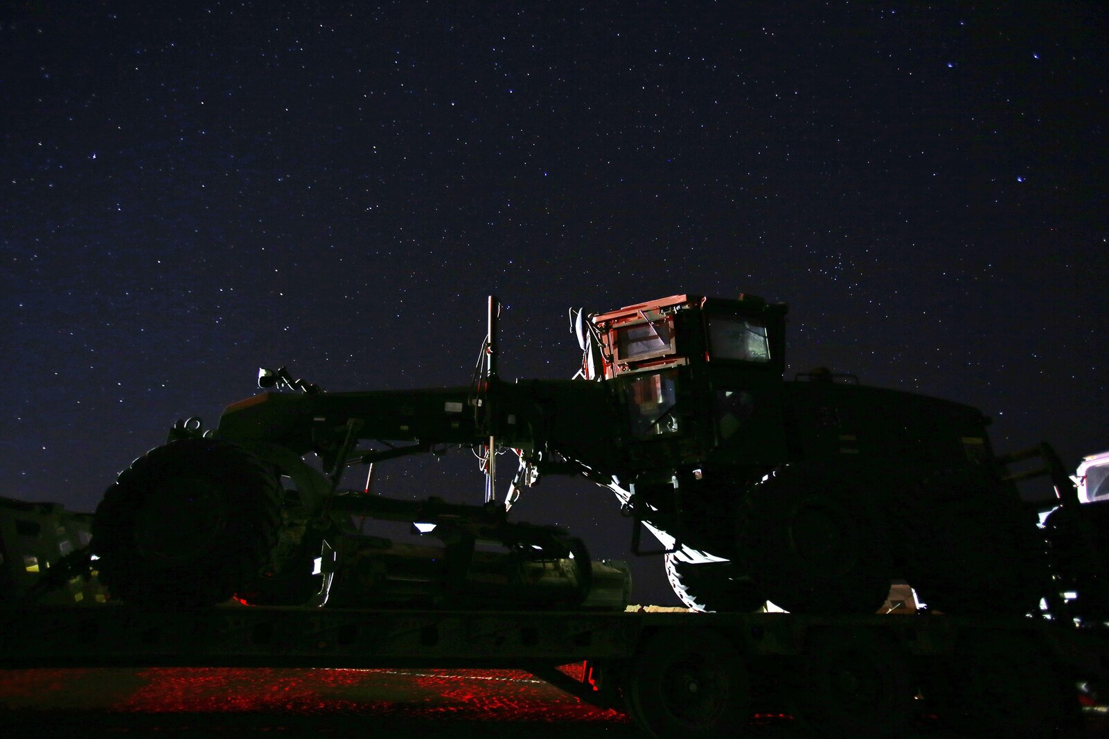 A 120M military motor grader is staged for transportation during the last week of the month-long Integrated Training Exercise 3-14 aboard Marine Corps Air Ground Combat Center Twenty-nine Palms, Calif., March 22, 2014. Marines with Combat Logistics Battalion 1, Combat Logistics Regiment 1, 1st Marine Logistics Group, conducted the pre-deployment training evolution to prepare the battalion for its role as the logistics combat element in the final combat deployment in support of Operation Enduring Freedom. 