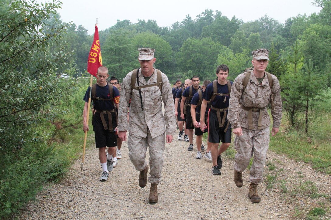 Captain Mark Adolphsen, executive officer, Recruiting Station Chicago leads poolees through a hike during a pool function, July 12.