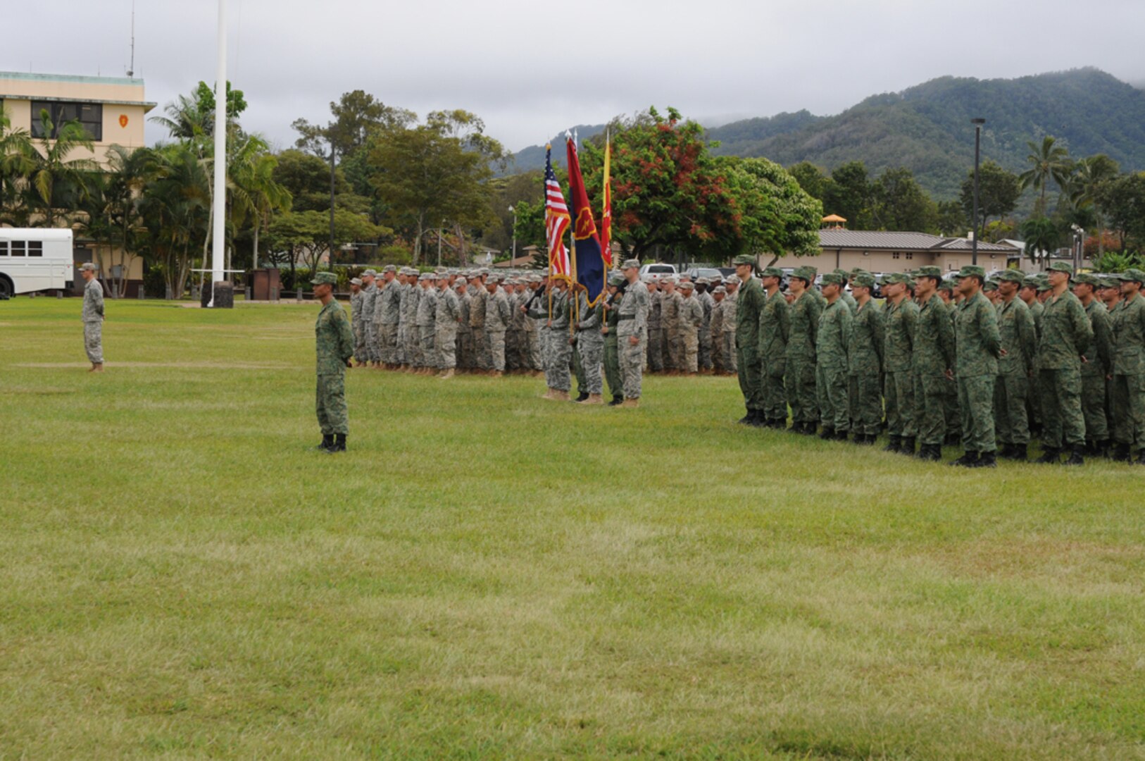 SCHOFIELD BARRACKS, Hawaii (July 14, 2014) - Soldiers from 2nd Battalion, 35th Infantry Regiment "Cacti," 3rd Brigade Combat Team, 25th Infantry Division, and a Singaporian rifle company, stand in formation during the opening ceremony, at Weyand Field, marking the official start of Tiger Balm 2014.  