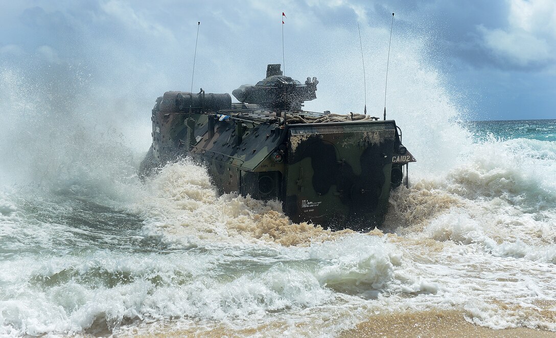 MARINE CORPS BASE HAWAII - A Marine Amphibious Assault Vehicle assigned to Combat Assault Company, 3rd Marine Regiment launches from the beach to amphibious dock landing ship USS Rushmore (LSD 47) during Rim of the Pacific (RIMPAC) Exercise 2014, July 9. Twenty-two nations, more than 40 ships and submarines, about 200 aircraft and 25,000 personnel are participating in RIMPAC from June 26 to August 1, in and around the Hawaiian Islands and Southern California. The world's largest international maritime exercise, RIMPAC provides a unique training opportunity that helps participants foster and sustain the cooperative relationships that are critical to ensuring the safety of sea lanes and security on the world's oceans. RIMPAC 2014 is the 24th exercise in the series that began in 1971. (U.S. Navy photo by Mass Communication Specialist 1st Class Shannon E. Renfroe/Released)