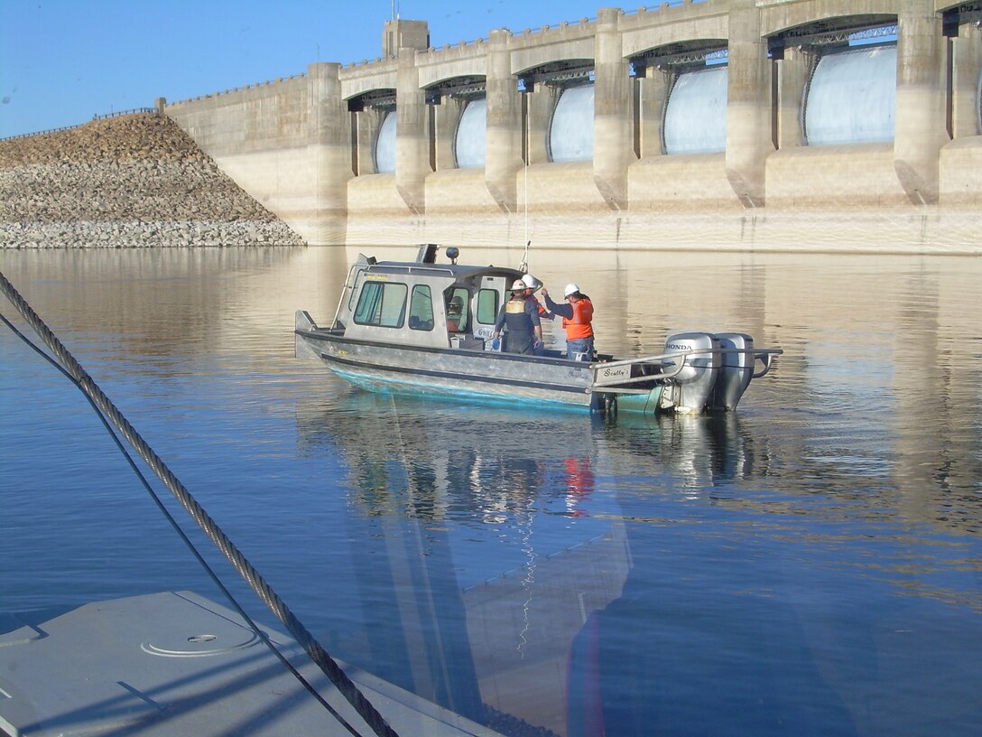 The contractor's support team performs dredging quality assurance operations during dayshift upstream of John Martin Dam in southeastern Colorado during dredging operations.
Photo by Tony V. Urquidez, Nov. 25, 2008.