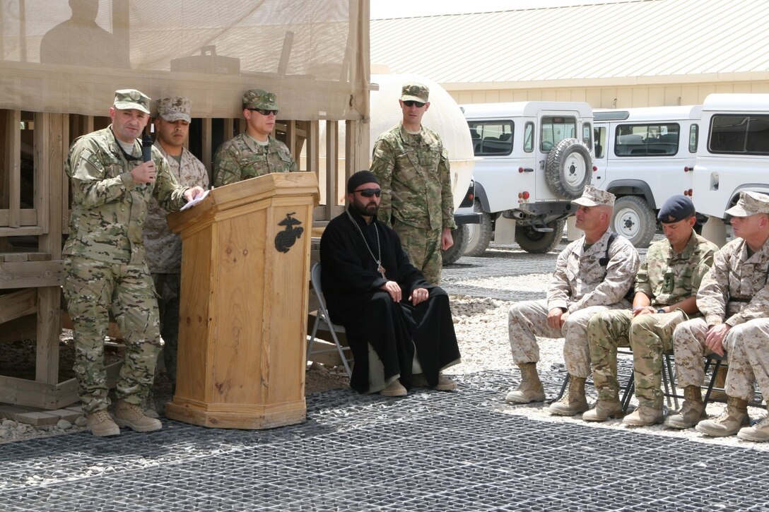 Col. Roman Jokhadze, left, Deputy Chief of General Staff of Georgia, addresses service members during the Georgian flag-lowering ceremony aboard Camp Leatherneck, Helmand province, Afghanistan, July 15, 2014. The ceremony marked the end of mission for the Republic of Georgia's army serving with Regional Command (Southwest).