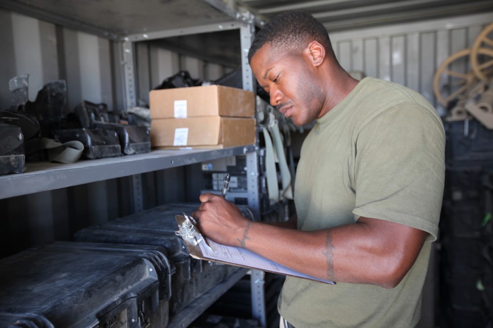 Corporal Charles Daniels, supply warehouse chief, 1st Battalion, 2nd Marine Regiment, takes inventory of some of the battalion's gear aboard Camp Leatherneck, Afghanistan, July 9, 2014. Daniels, a native of Baton Rouge, La., and only four other Marines are the responsible holders and maintainers of 1st Bn., 2nd Marines' $117 million supply of gear and equipment to be retrograded upon the unit's redeployment. (U.S. Marine Corps Photo By: Sgt. Frances Johnson)