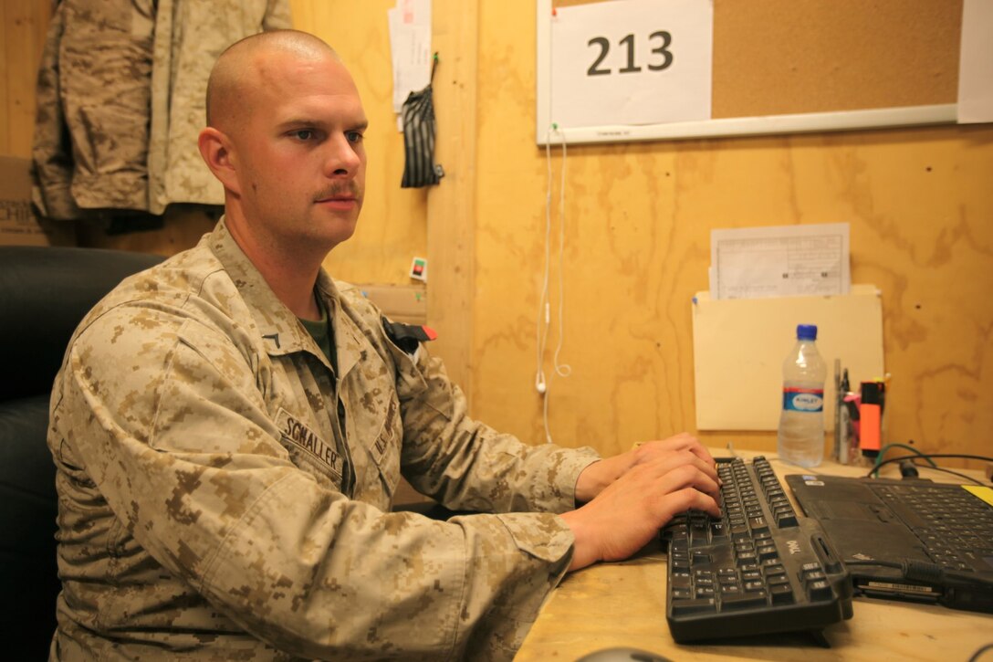 Private First Class Benjamin Schaller, supply administration clerk, 1st Battalion, 2nd Marine Regiment, types up inventory information into a tracking document aboard Camp Leatherneck, Afghanistan, July 9, 2014. Schaller, a native of Portland, Ore., and only four other Marines are the responsible holders and maintainers of 1st Bn., 2nd Marines' $117 million supply of gear and equipment to be retrograded upon the unit's redeployment. (U.S. Marine Corps Photo By: Sgt. Frances Johnson)