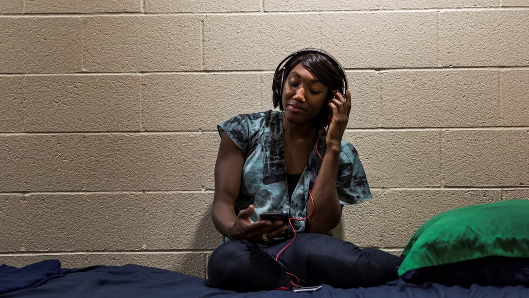 Corporal Ashton Tyler, warehouse clerk, 15th Marine Expeditionary Unit, unwinds after a hard day at work by listening to music aboard Camp Pendleton, Calif., July 15, 2014. Tyler, 22, is from Charleston, South Carolina. (U.S. Marine Corps photo by Cpl. Emmanuel Ramos/Released)