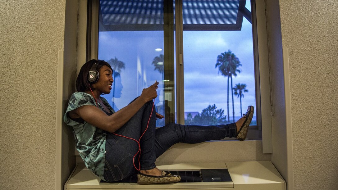 Corporal Ashton Tyler, warehouse clerk, 15th Marine Expeditionary Unit, unwinds after a hard day at work by listening to music aboard Camp Pendleton, Calif., July 15, 2014. Tyler, 22, is from Charleston, South Carolina. (U.S. Marine Corps photo by Cpl. Emmanuel Ramos/Released)