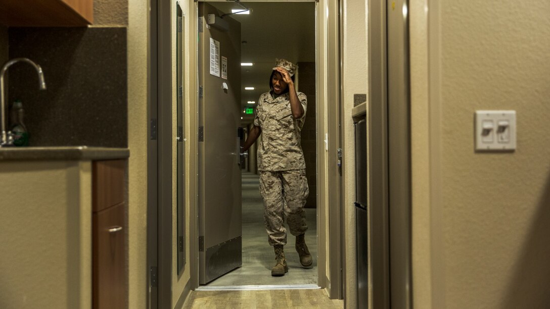 Corporal Ashton Tyler, warehouse clerk, 15th Marine Expeditionary Unit, retires to the comfort of her room after a hard day at work aboard Camp Pendleton, Calif., July 15, 2014. Tyler, 22, is from Charleston, South Carolina. (U.S. Marine Corps photo by Cpl. Emmanuel Ramos/Released)