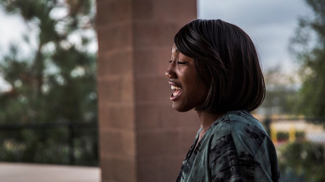 Corporal Ashton Tyler, warehouse clerk, 15th Marine Expeditionary Unit, relaxes from the rigors of work by singing aboard Camp Pendleton, Calif., July 15, 2014. Tyler, 22, is from Charleston, South Carolina. (U.S. Marine Corps photo by Cpl. Emmanuel Ramos/Released)