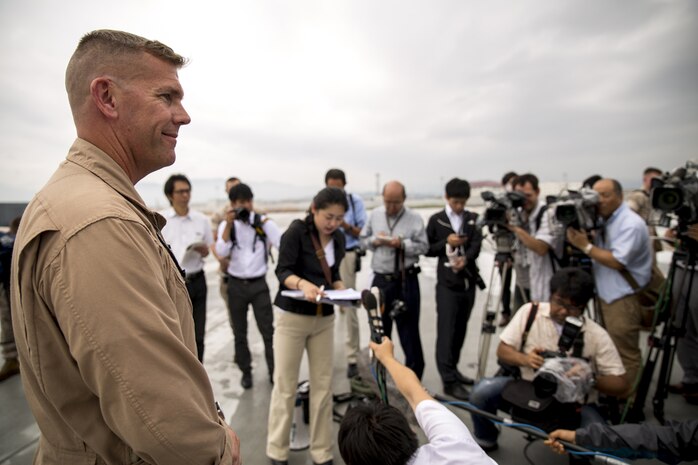 Lt. Col. Matthew W. Stover, commanding officer of Marine Aerial Refueler Transport Squadron 152, gives an opening statement to Japanese media upon arrival at Marine Corps Air Station Iwakuni, Japan, July 15, 2014.Upon the KC-130J Super Hercules’ touchdown, administrative control of the squadron effectively changed from MCAS Futenma’s, based out of Okinawa, Japan, Marine Aircraft Group-36 to MAG-12 on Iwakuni. VMGR-152 will remain under operational control of III Marine Expeditionary Force in Okinawa, but MAG-12 will be in charge of providing the squadron with all the gear and supplies necessary in carrying out their missions.