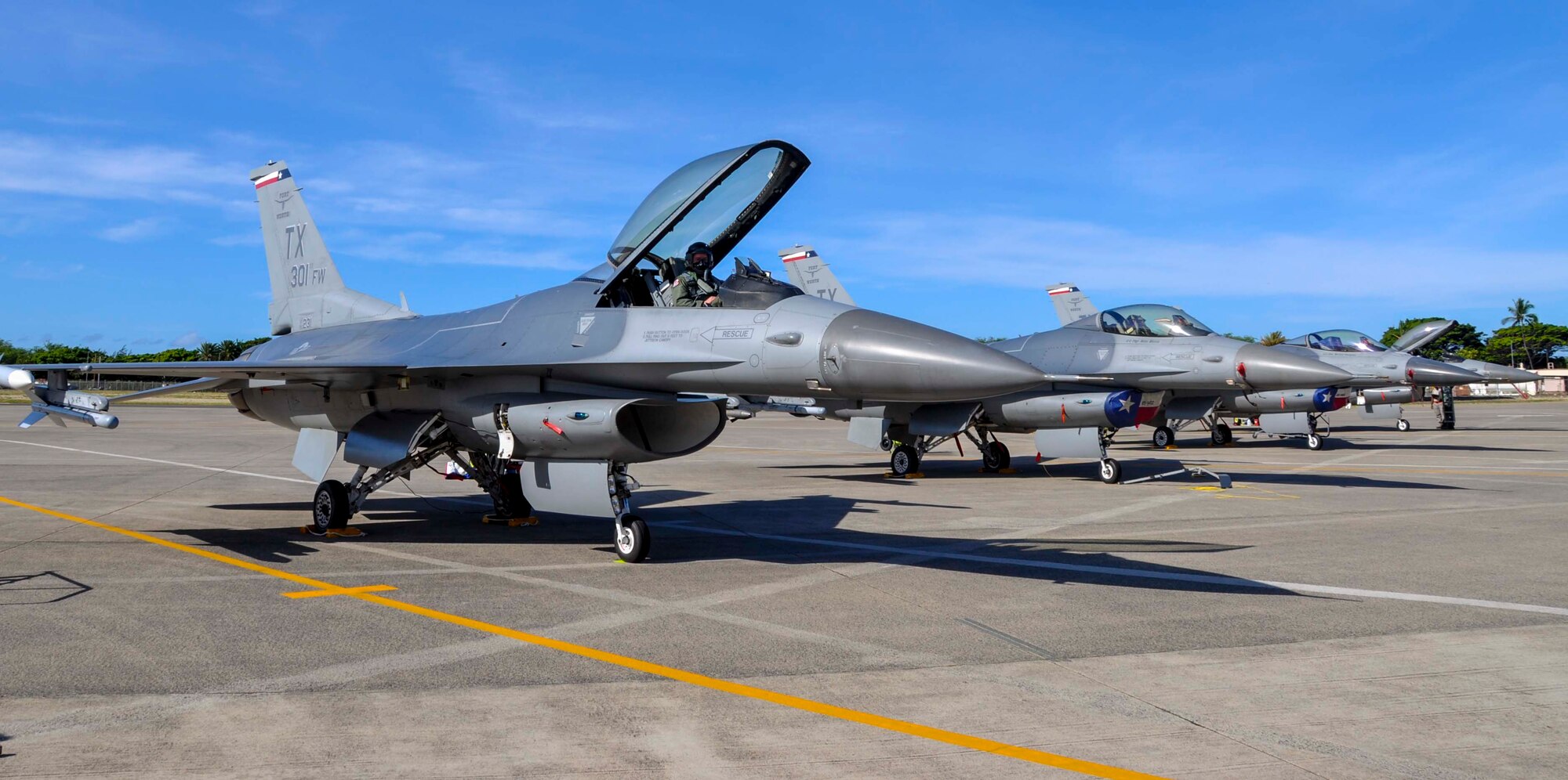 Pilots from the 457th Fighter Squadron at Naval Air Station Fort Worth Joint Reserve Base Carswell Field, Texas, prepare for take-off from the flightline at Joint Base Pearl Harbor-Hickam, Hawaii, July 15, 2014. The F-16C Fighting Falcons are here in support of Rim of the Pacific 2014. RIMPAC is a U.S. Pacific Command-hosted biennial multinational maritime exercise designed to foster and sustain international cooperation on the security of the world's oceans. (U.S. Air Force photo by Tech. Sgt. Mario Dorado)
