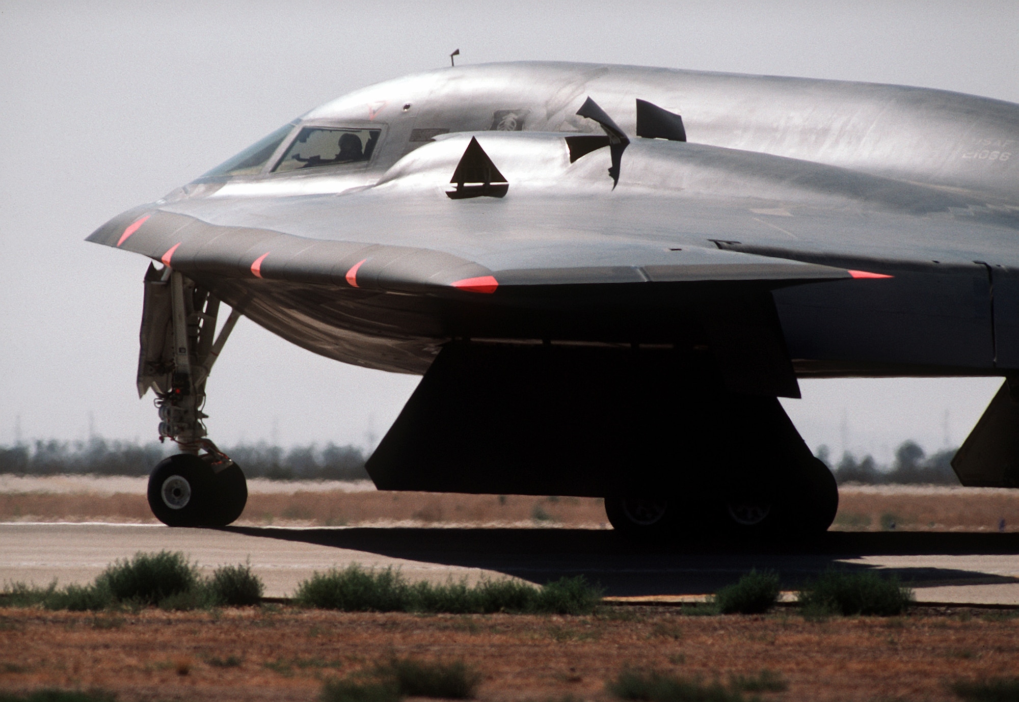 A B-2 Spirit bomber lines up on the runway July 17, 1989, at the Northrop Grumman production facility in Palmdale, California. The first flight was just over two hours long, and ended at Edwards Air Force Base, California, where the aircraft underwent further testing both on the ground and in the air. (Defense Imagery Management Operations Center photo/Released) 