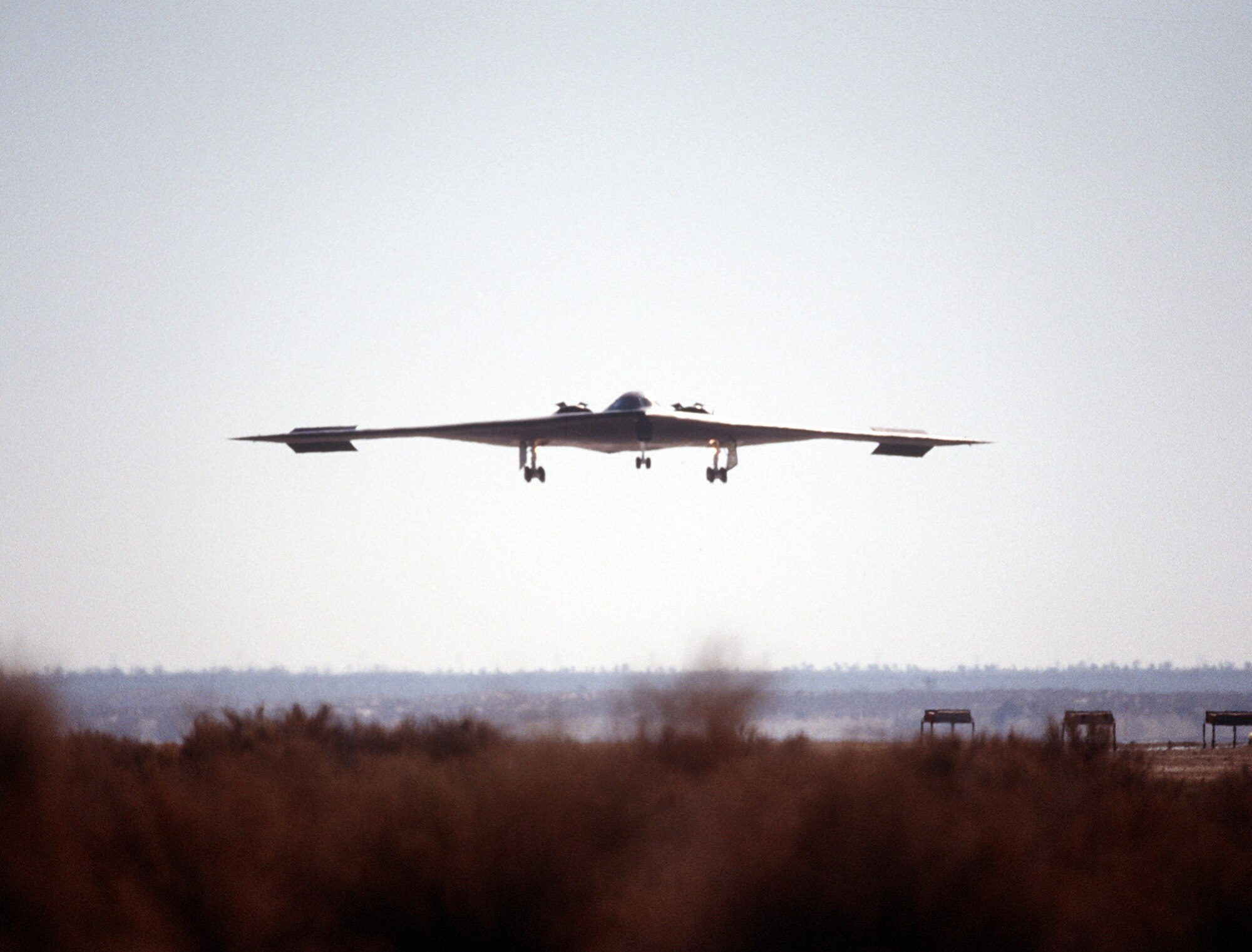 A B-2 Spirit bomber lines up on the runway July 17, 1989, at the Northrop Grumman production facility in Palmdale, California. The first flight was just over two hours long, and ended at Edwards Air Force Base, California, where the aircraft underwent further testing both on the ground and in the air. (Defense Imagery Management Operations Center photo/Released)
