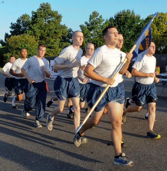 The Barksdale Honor Guard run in formation during the Freedom 5K fun run on Barksdale Air Force Base, La., July 11, 2014. The Honor Guard chose to start running together to foster team building and resiliency throughout their commitment to the organization. (U.S. Air Force photo/Senior Airman Kristin High)