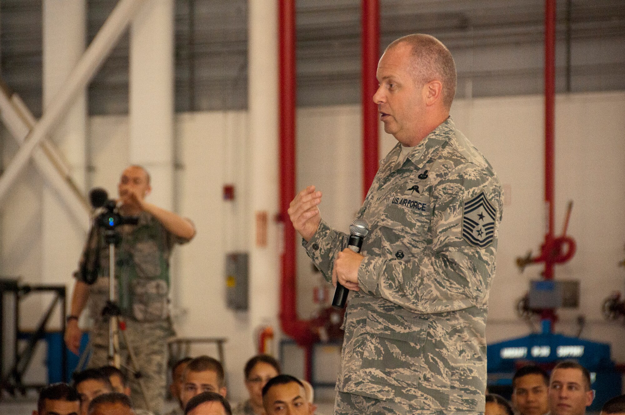 Air National Guard Command Chief James W. Hotaling speaks to members of the 129th Rescue Wing during a visit to Moffet Federal Airfield, Calif., July 12, 2014. Hotaling spoke to Airmen about the past, present and future of the ANG. (U.S. Air National Guard photo by Senior Airman Rachael Kane/Released)