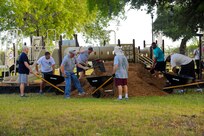 More than 20 enlisted Airmen participated in the Eberle Park Renovation project  July 12 at Joint Base San Antonio-Randolph. The day’s mission included spreading mulch in playgrounds, adding sand to the outside volleyball court, power-washing, painting, and cleaning up. Volunteers were members of either the Randolph Top Three or Randolph Chief’s Group. (U.S. Air Force photo by Senior Airman Kenna Jackson)