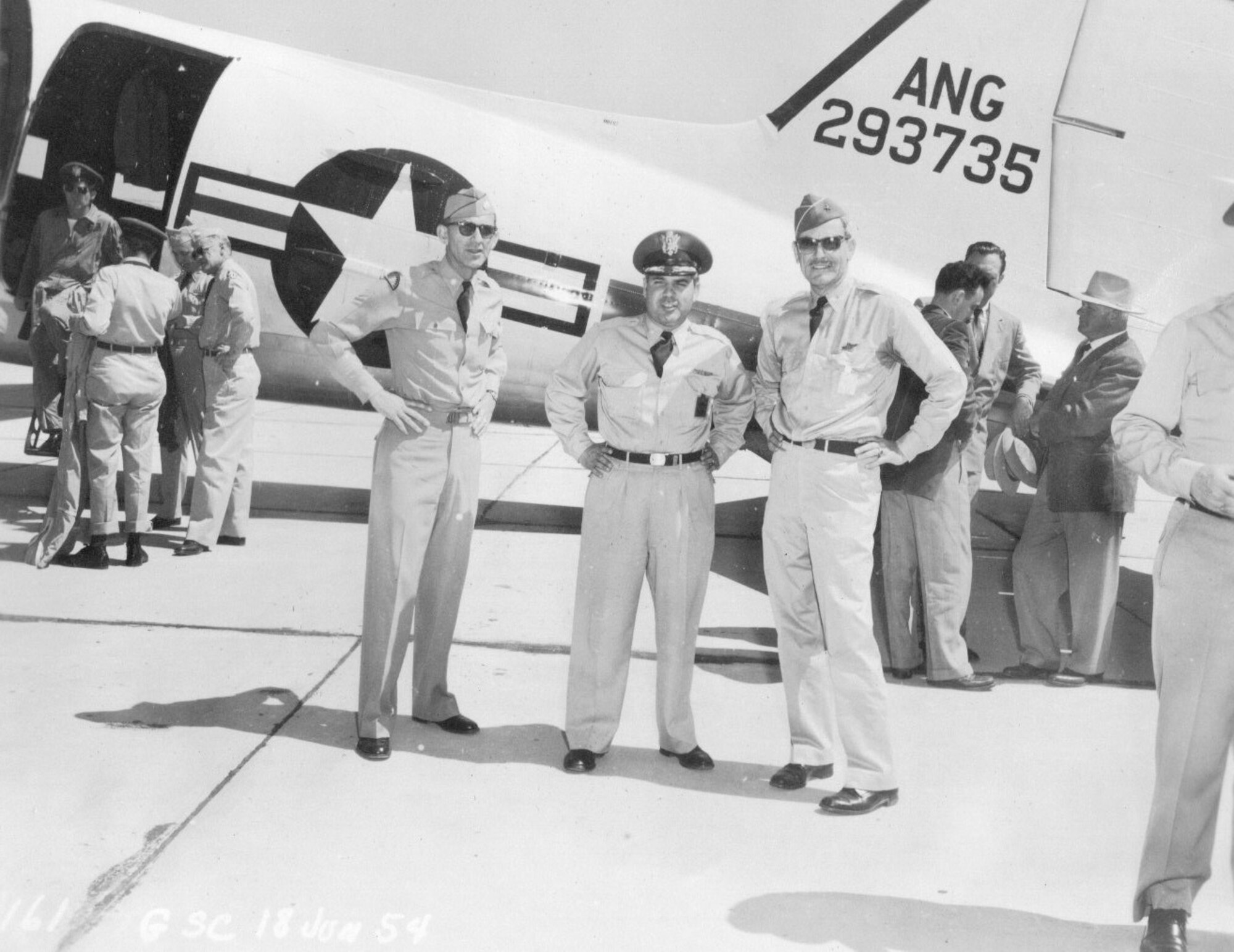 National Guard leaders on the ramp at Gowen Field, Idaho, June, 18 1954.  Left to right are an unidentified field grade officer with what may be the 41st Infantry Division emblem on his shoulder, Col. Frank W. Frost, Commander of the 142nd Fighter-Interceptor Wing, and Brig. Gen. G. Robert Dodson, Commander of the Oregon ANG.  (Courtesy 142FW History Archives)