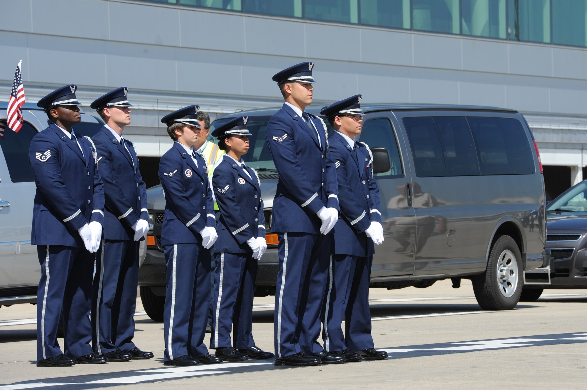 Members of the Scott Air Force Base, Ill. Honor Guard await the dignified arrival of Airman 3rd Class Howard Martin during a dignified arrival at the Indianapolis International Airport on July 10, 2014. Martin died in 1952 after a C-124 crash. His remains were recovered and identified earlier in 2014. (U.S. Air Force photo by Senior Airman Sarah Hall-Kirchner)