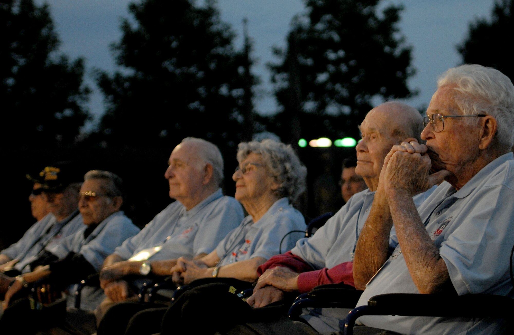 Members of an Honor Flight from Austin, Texas, listen to The United States Air Force Band at the Air Force Memorial in Arlington, Va., July 11, 2014.  The event was part of the band’s Summer Concert Series, where visitors can see the band play at various locations in the National Capital Region. (U.S. Air Force photo/Airman 1st Class Ryan J. Sonnier)