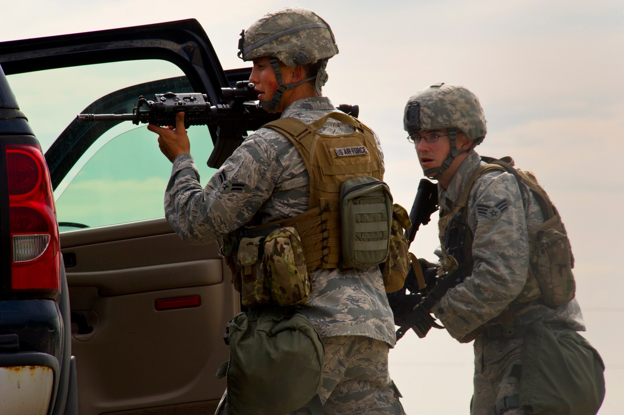 Airmen from the 91st Missile Security Forces Squadron search a vehicle during a training exercise in North Dakota, July 11, 2014. The purpose of this training is to maintain readiness for launch facility recapture. (U.S. Air Force photo/Senior Airman Brittany Y. Bateman)
